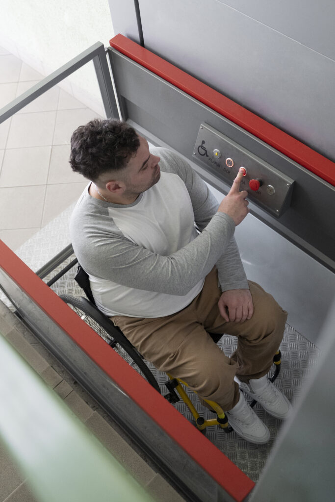 full shot man wheelchair using elevator